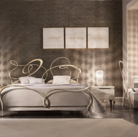 Wrought iron bed with Cantori swirls headboard.