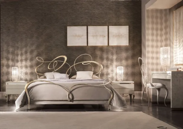 Wrought iron bed with Cantori swirls headboard.