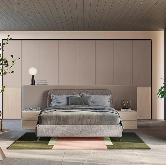 Fabric bed with Golf Verso headboard by Colombini Casa.