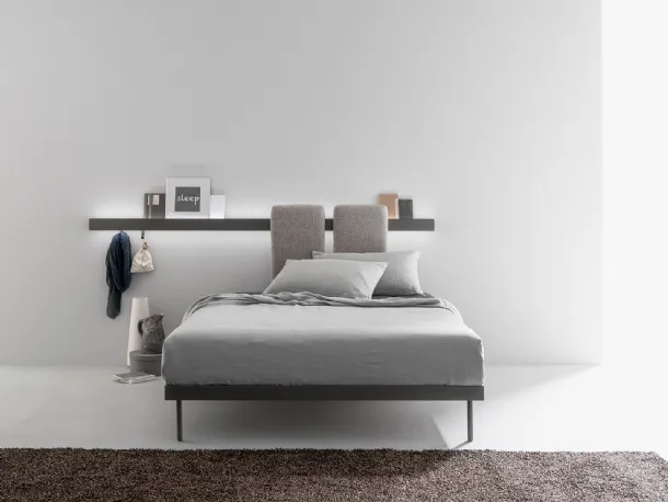 Metal bed with sliding, padded and removable panels to be hooked onto the bar fixed to the Groove Run wall by Caccaro.