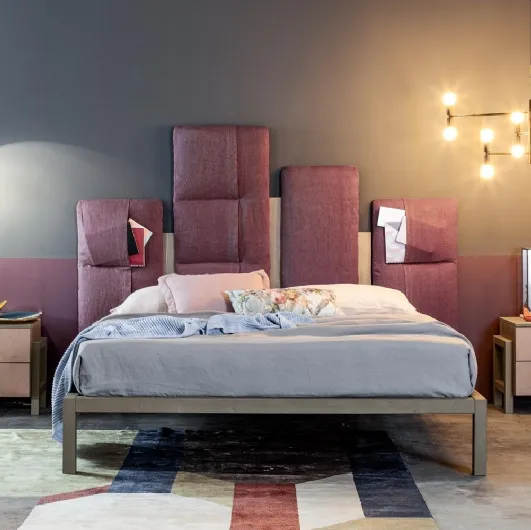 Indio bed with padded headboard by Callesella.