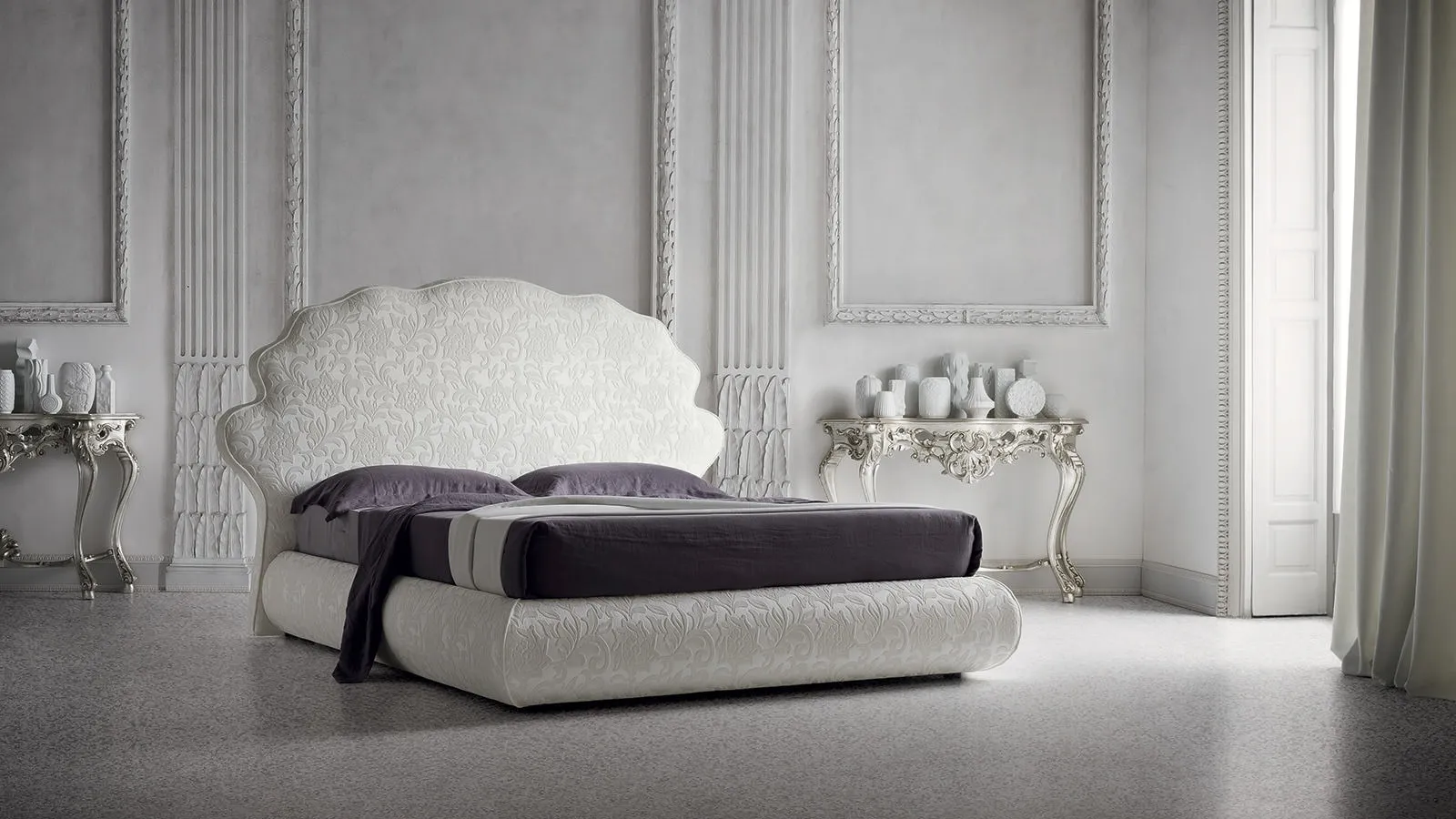 Tone-on-tone floral fabric bed with Jason headboard by Felis.