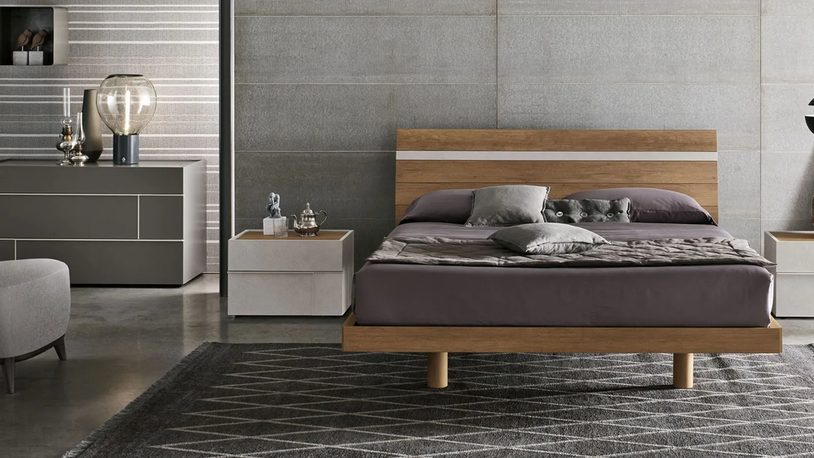 Bed with a light textured knotted headboard and Tomasella's Joker cement textured insert.
