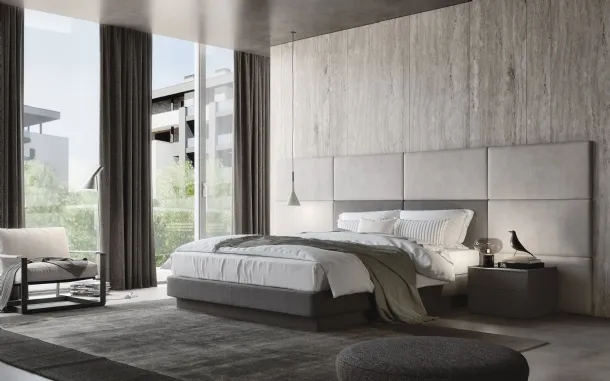 Fabric bed with imposing Jolly headboard with 9 padded panels of S75.