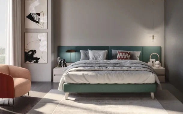 Fabric bed with Jolly headboard and padded panels in S75 fabric.