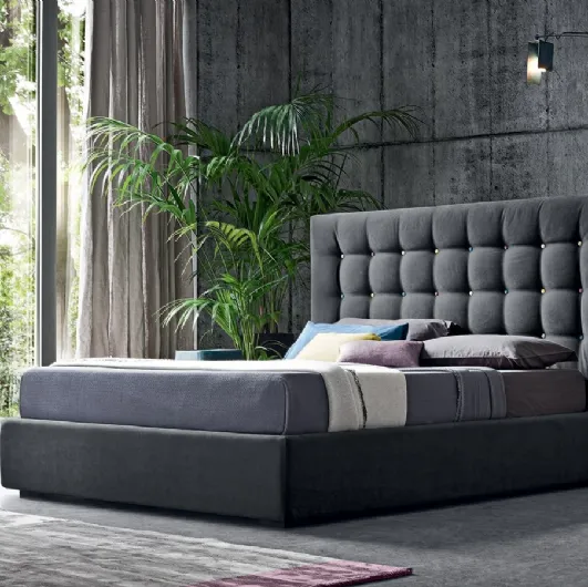 Fabric bed with Karl de Felis multicolored button-tufted headboard.