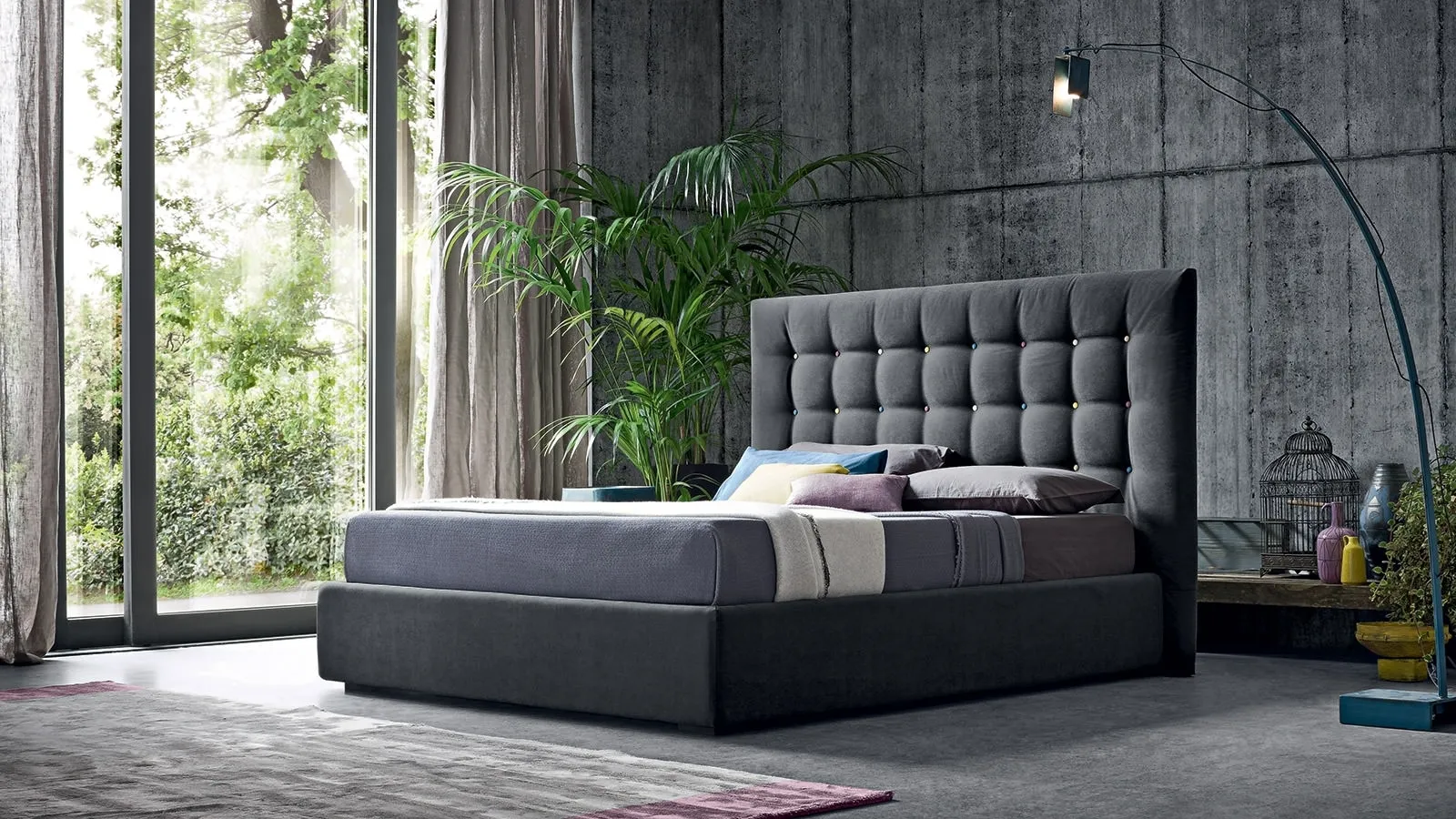 Fabric bed with Karl de Felis multicolored button-tufted headboard.