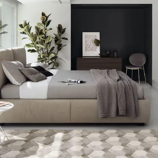 Magenta upholstered bed with storage by Calligaris.