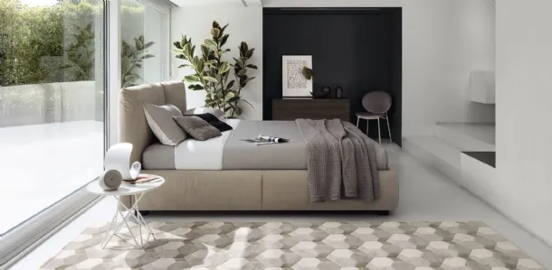 Magenta upholstered bed with storage by Calligaris.