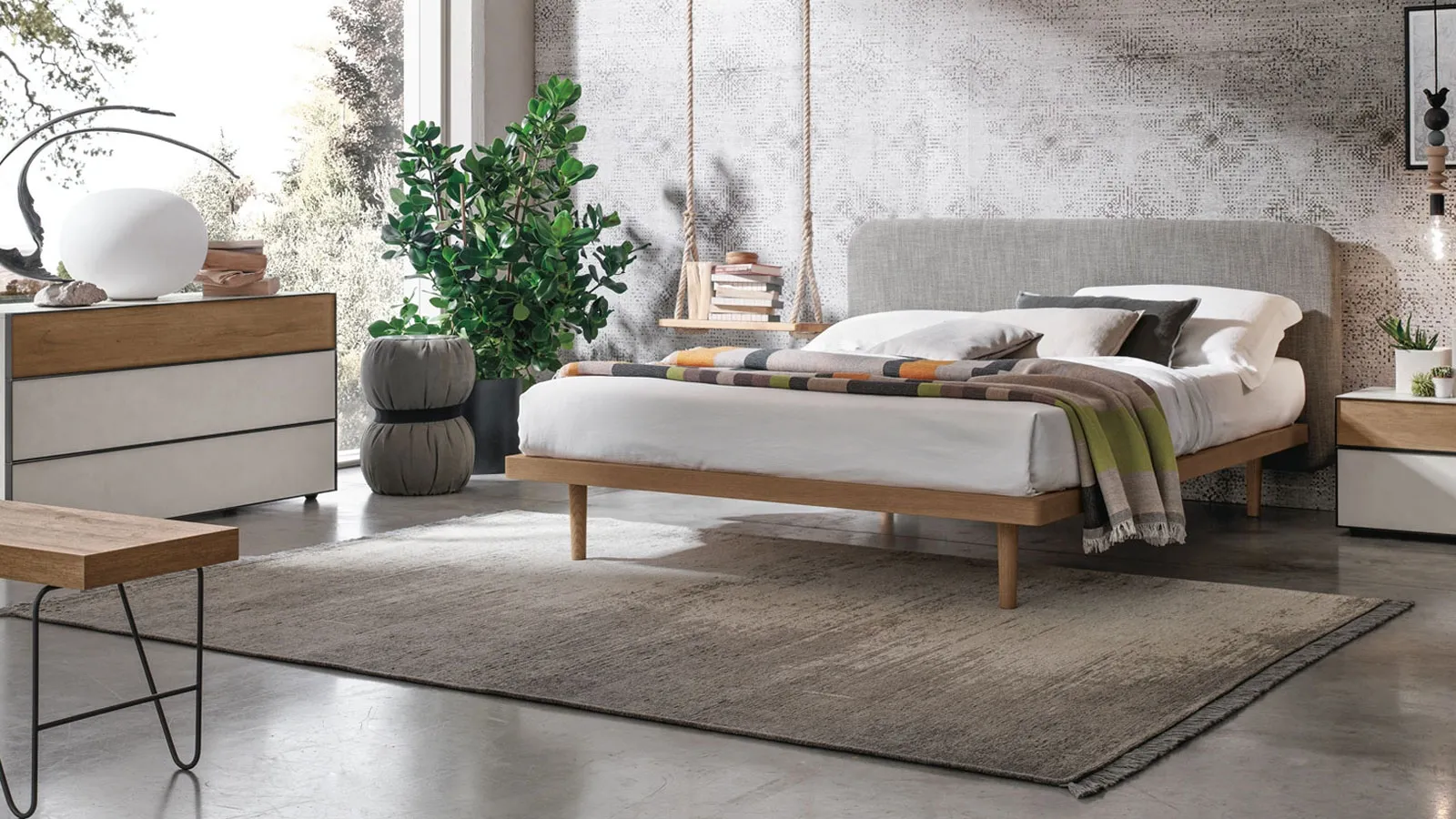 Wooden bed with Milly fabric headboard by Tomasella.