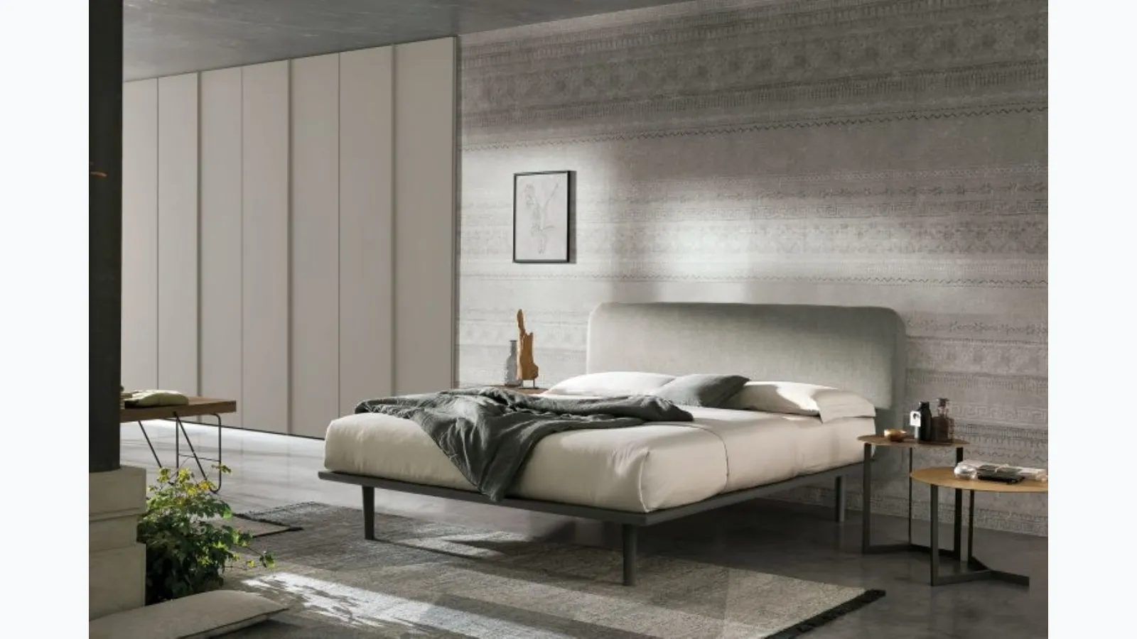 Wooden bed with Milly fabric headboard by Tomasella.