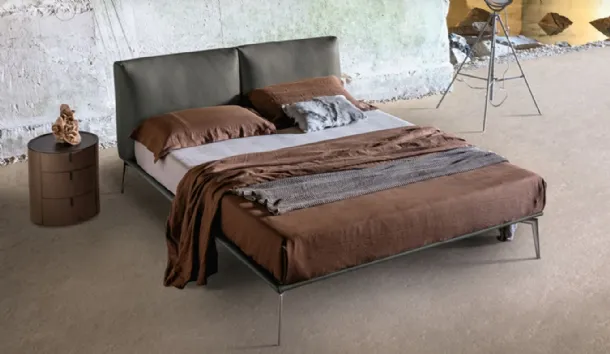 Papillon upholstered leather headboard bed by Alivar.