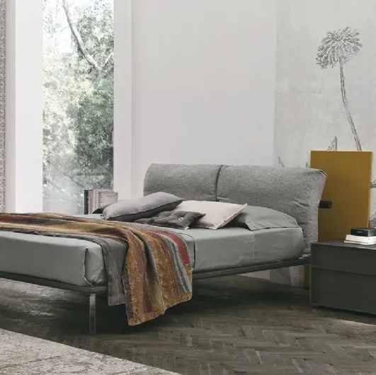Feather bed with padded fabric headboard by Tomasella.