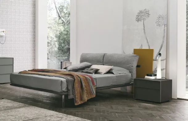 Feather bed with padded fabric headboard by Tomasella.