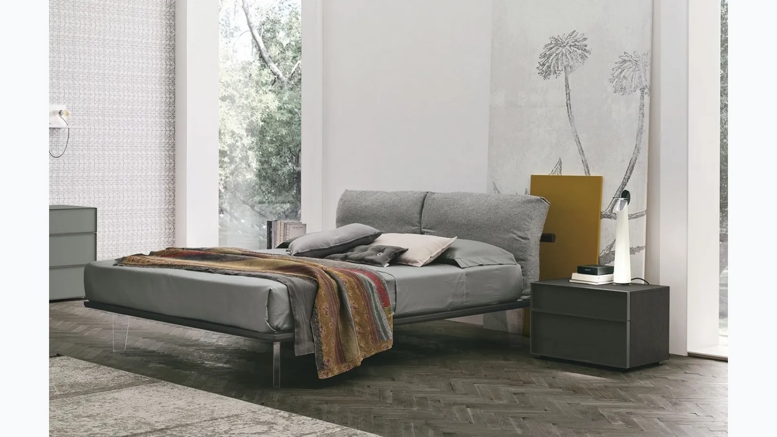 Feather bed with padded fabric headboard by Tomasella.