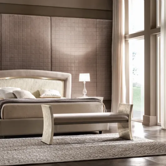 Classic bed with upholstered headboard with Portofino gold details by Cantori