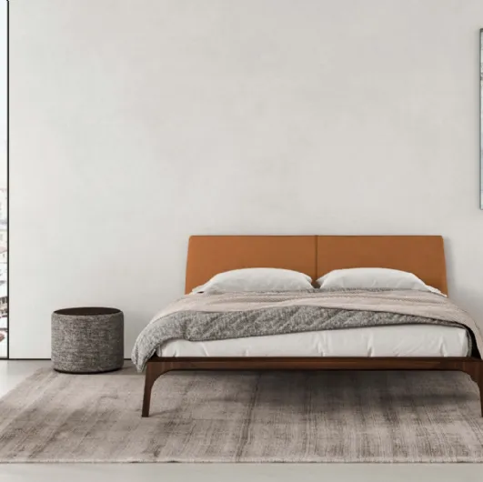 Padded Relevè Bed with a leather-covered headboard by Presotto.