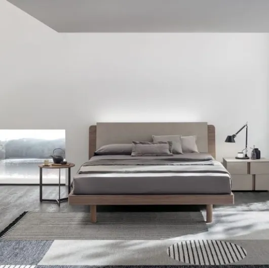 Read in amber walnut and quarry cement textured bed with Tomasella's Roxy headboard.