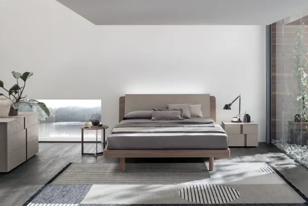 Read in amber walnut and quarry cement textured bed with Tomasella's Roxy headboard.