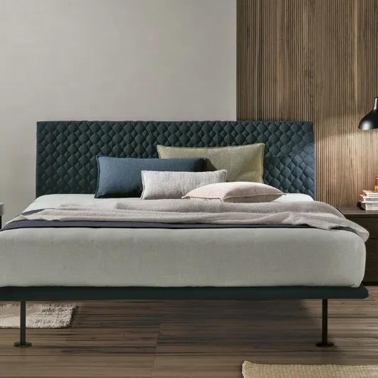 Seven Plus bed with padded headboard by Tomasella