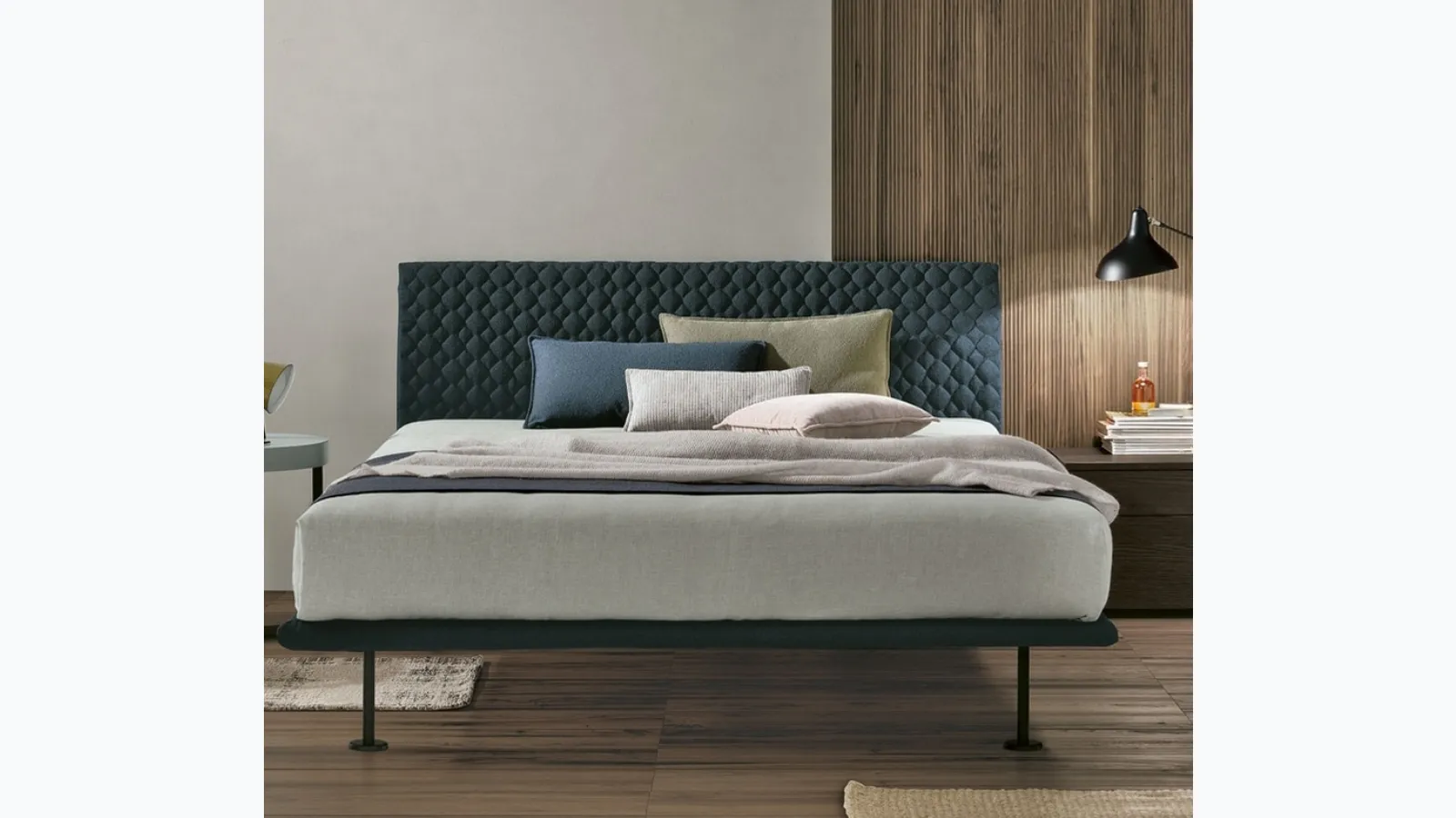 Seven Plus bed with padded headboard by Tomasella