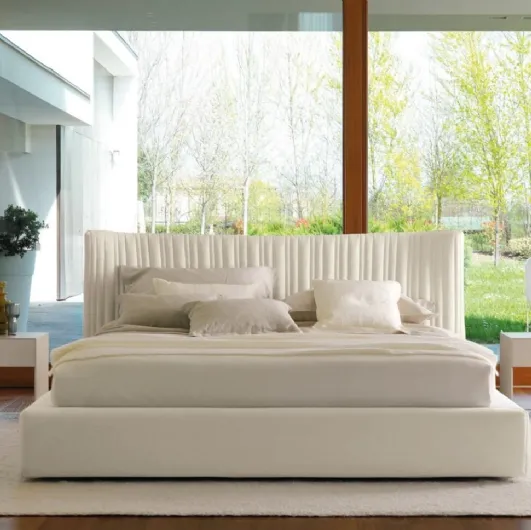 Fabric bed with storage box and sinuous headboard with irregularly quilted 