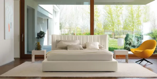 Fabric bed with storage box and sinuous headboard with irregularly quilted 