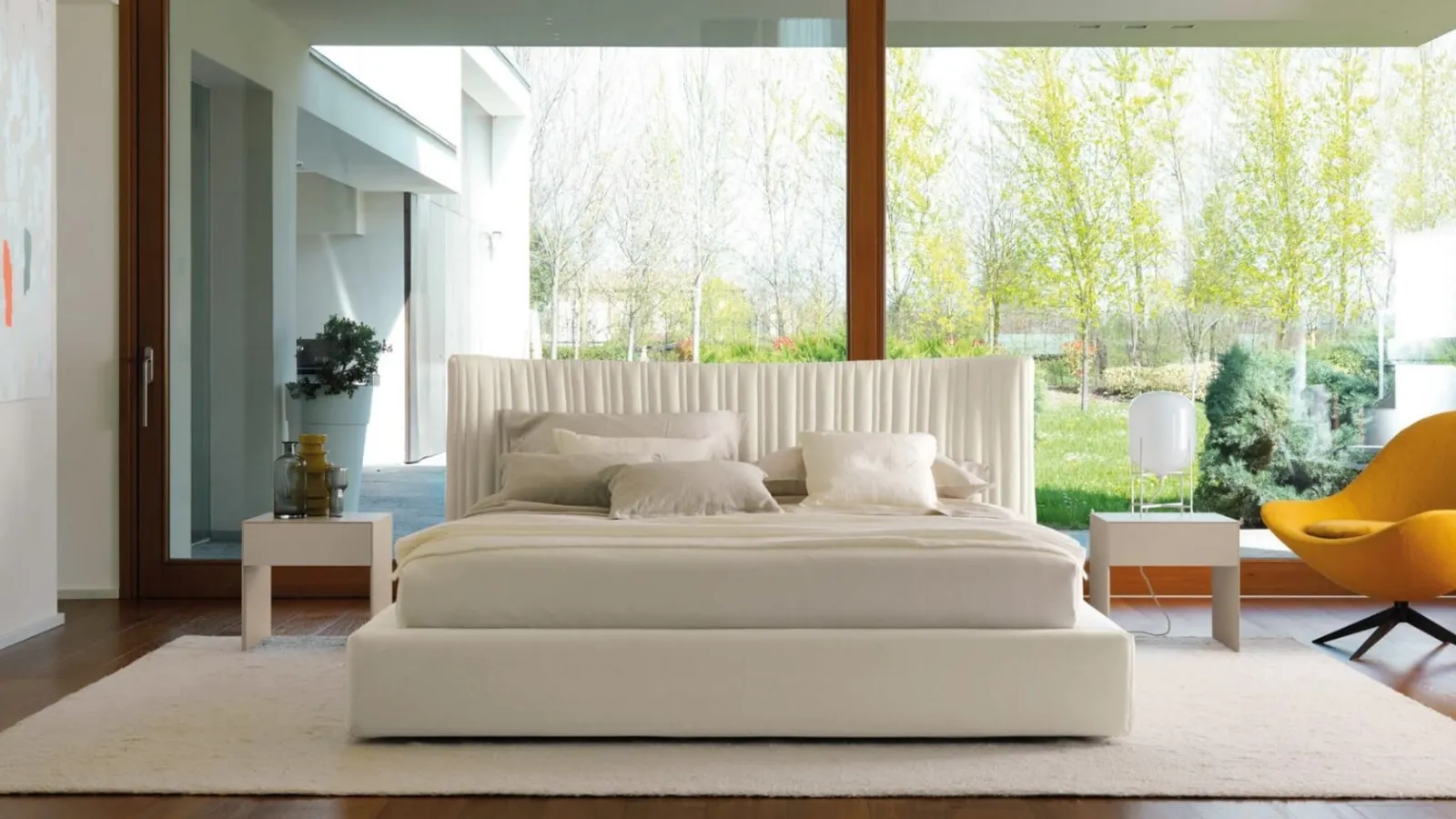 Fabric bed with storage box and sinuous headboard with irregularly quilted 