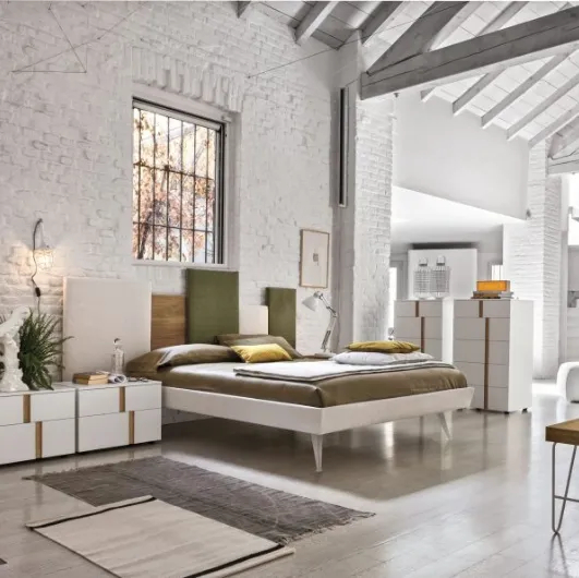 Upholstered fabric bed with Skyline headboard by Tomasella.