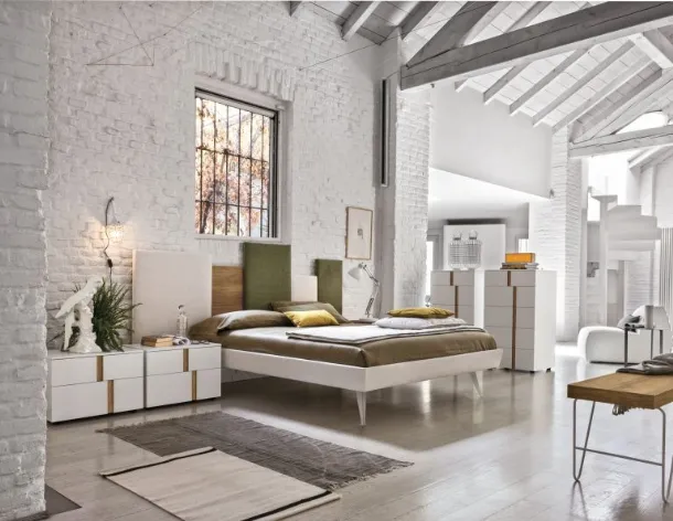 Upholstered fabric bed with Skyline headboard by Tomasella.