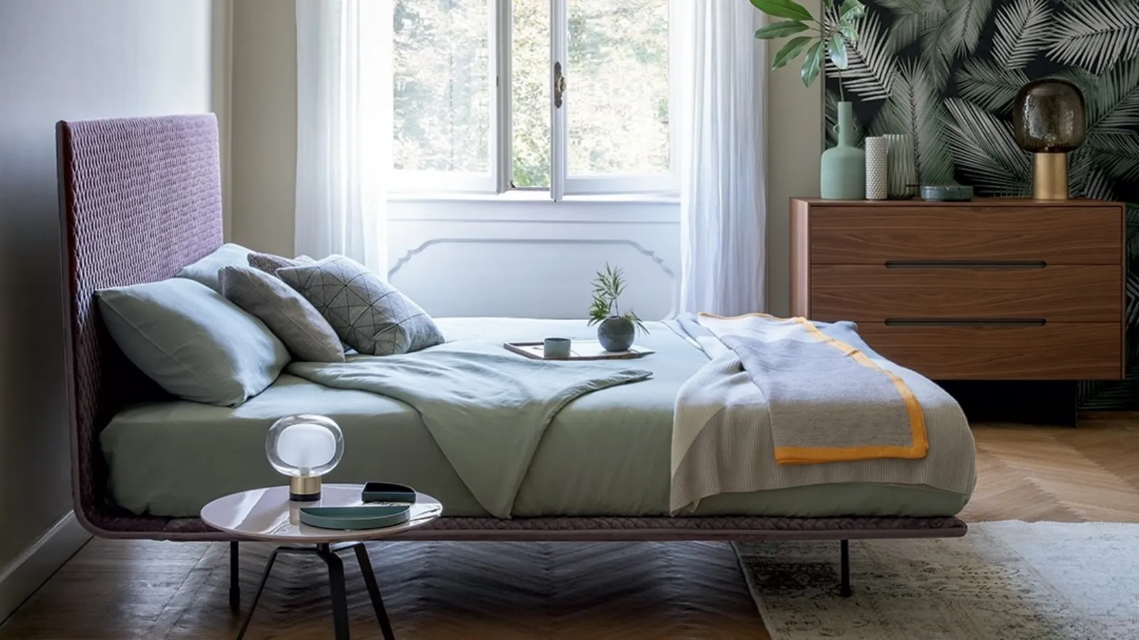 Bonaldo's Thin bed in quilted fabric with headboard.