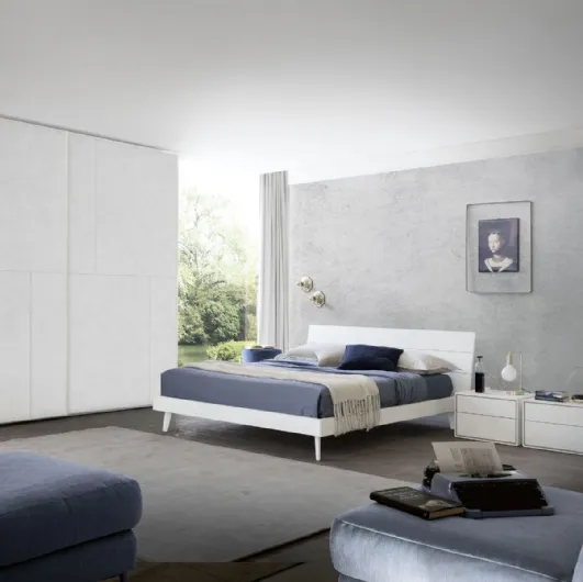 Bed with headboard in white cement finish Wall of S75.