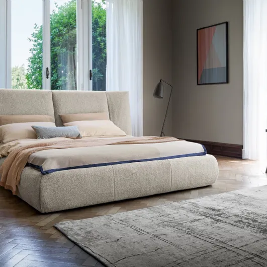 Bed with Youniverse headboard and storage box by Bonaldo.