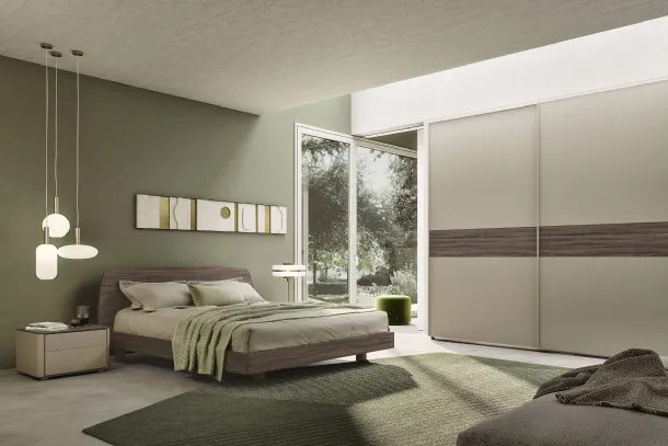 Round bedside table with a clay finish frame and a dark elm top by S75.