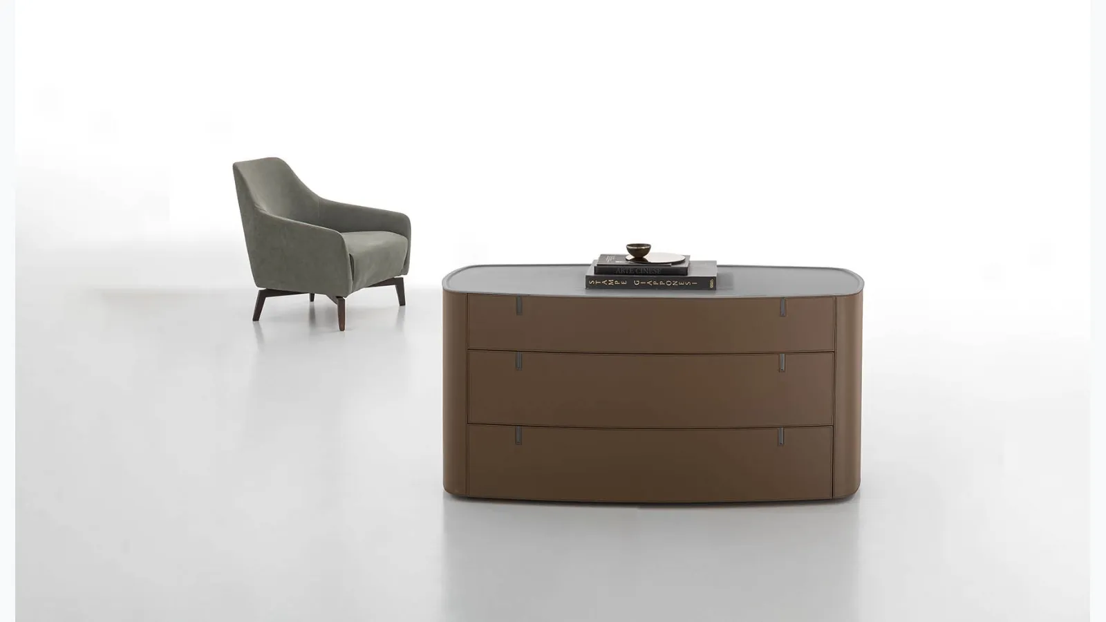 Round leather-covered dresser with top in Alivar's acrylic stone.