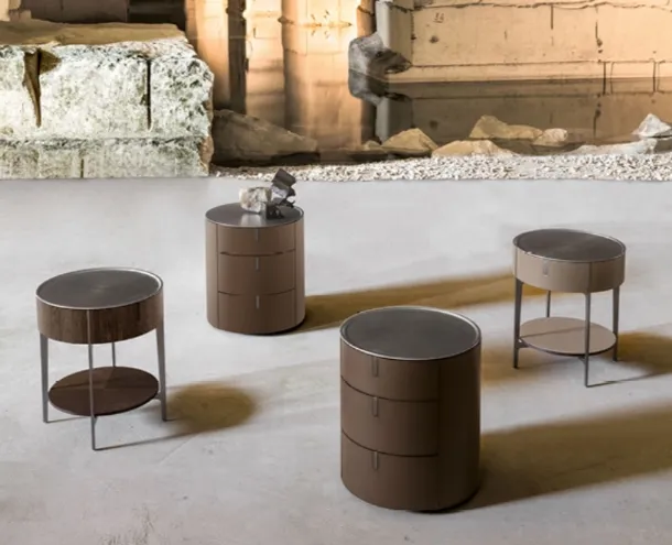 Round bedside table covered in leather with a steel top by Alivardi Alivar.
