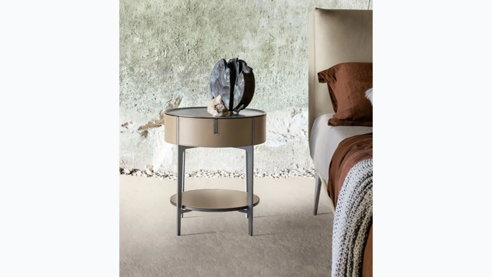 Round bedside table covered in leather with steel top by Alivardi Alivar.