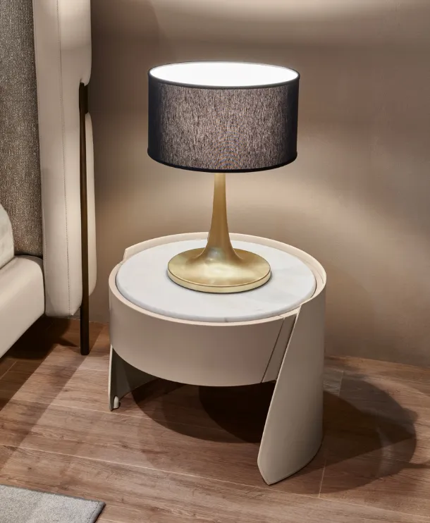 Leather covered bedside table with Sharon marble top by Cantori.