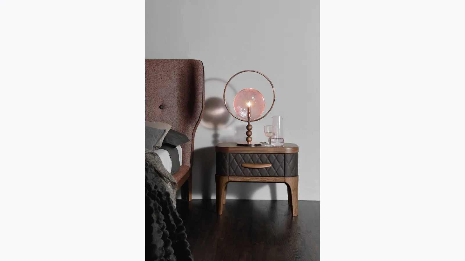 Wooden bedside table with quilted diamond-patterned Tiffany leather covering by Tonin Casa.