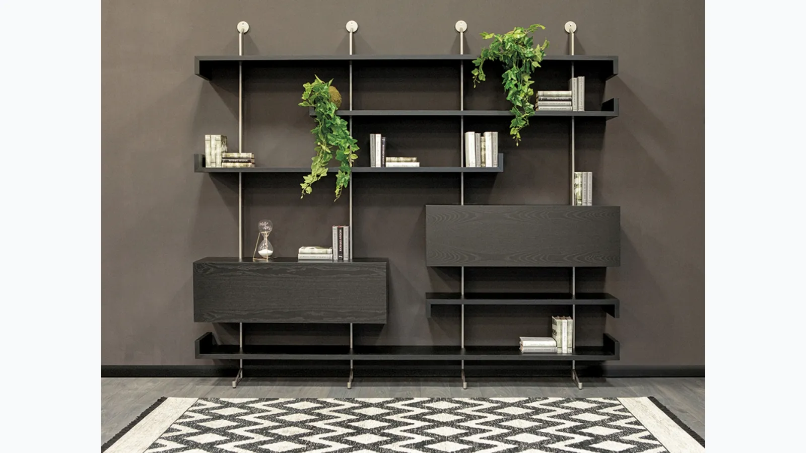Wooden wall library with metal uprights Plan by Tonin Casa.