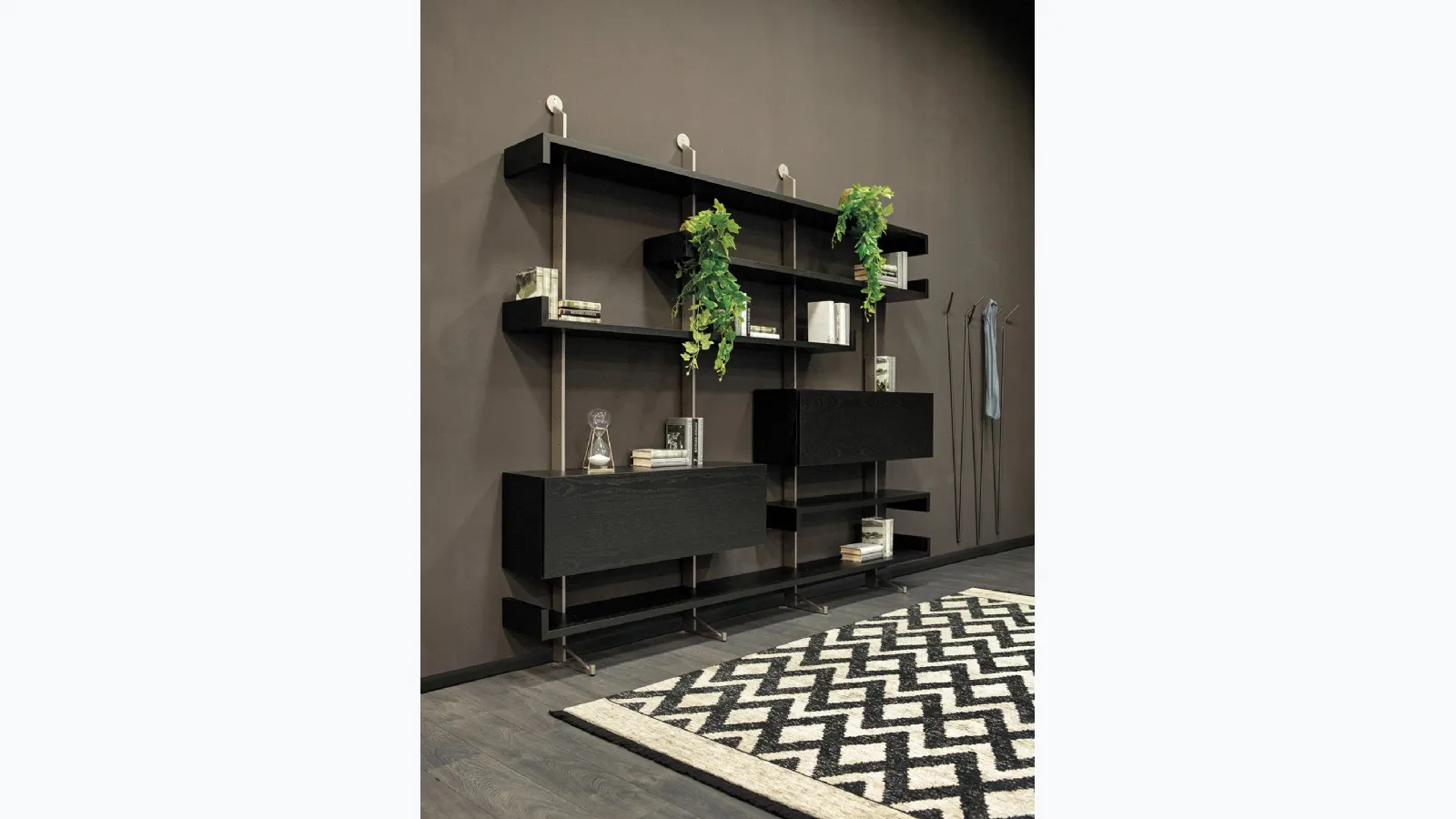Wooden wall library with metal uprights Plan by Tonin Casa.