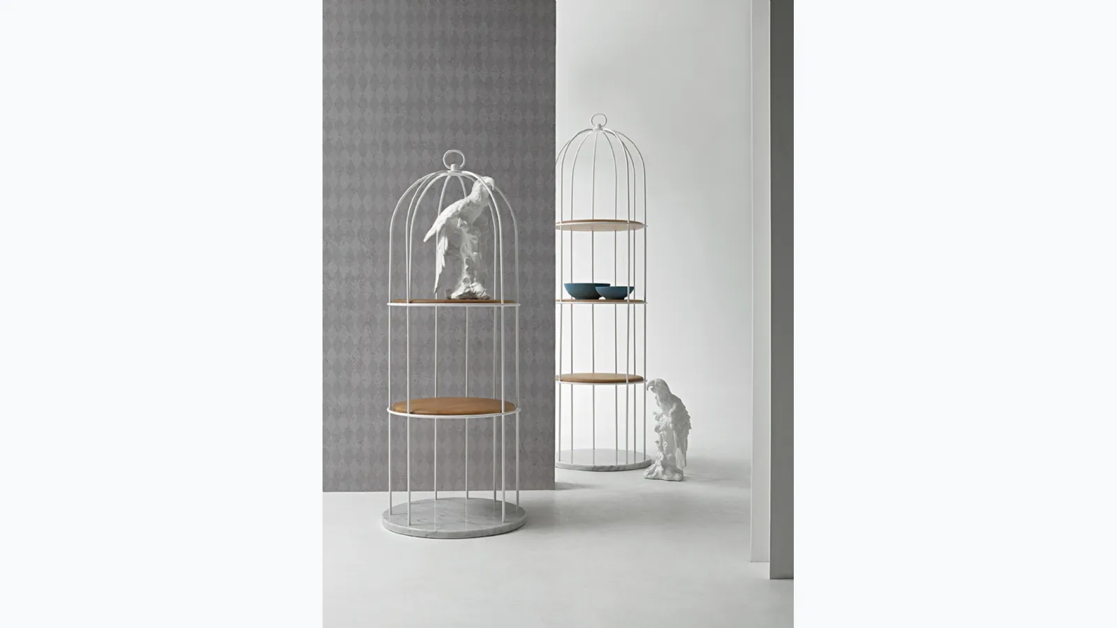 Freestanding metal Tweet bookcase with solid wood shelves and marble base by Tonin Casa.