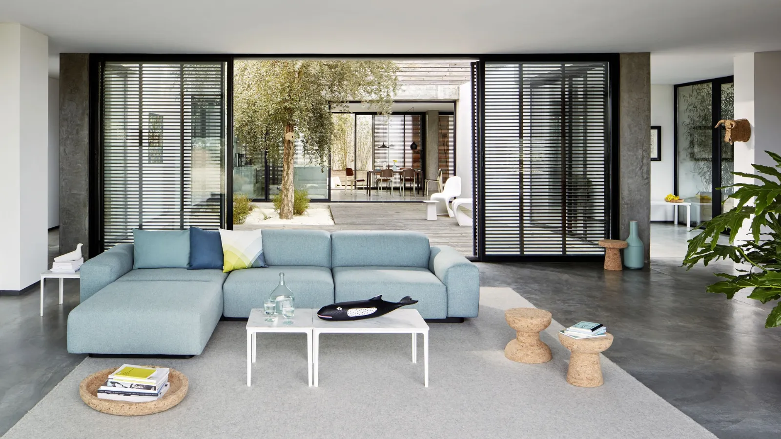 Fabric sofa with Soft Modular peninsula by Vitra.
