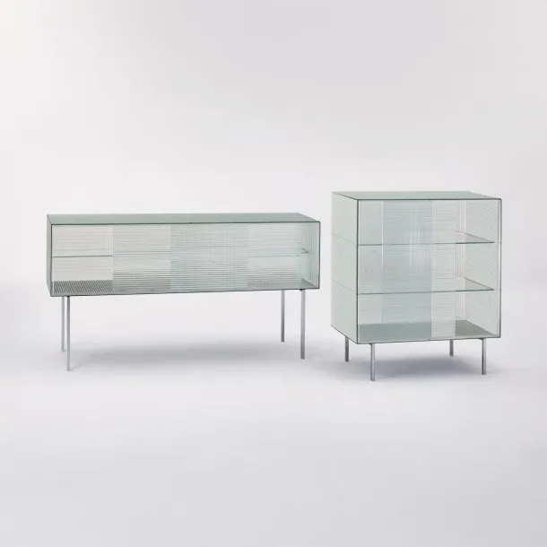 Madie Commodore with sliding doors in printed glass with square pattern and shiny chromed metal feet by Glas Italia.