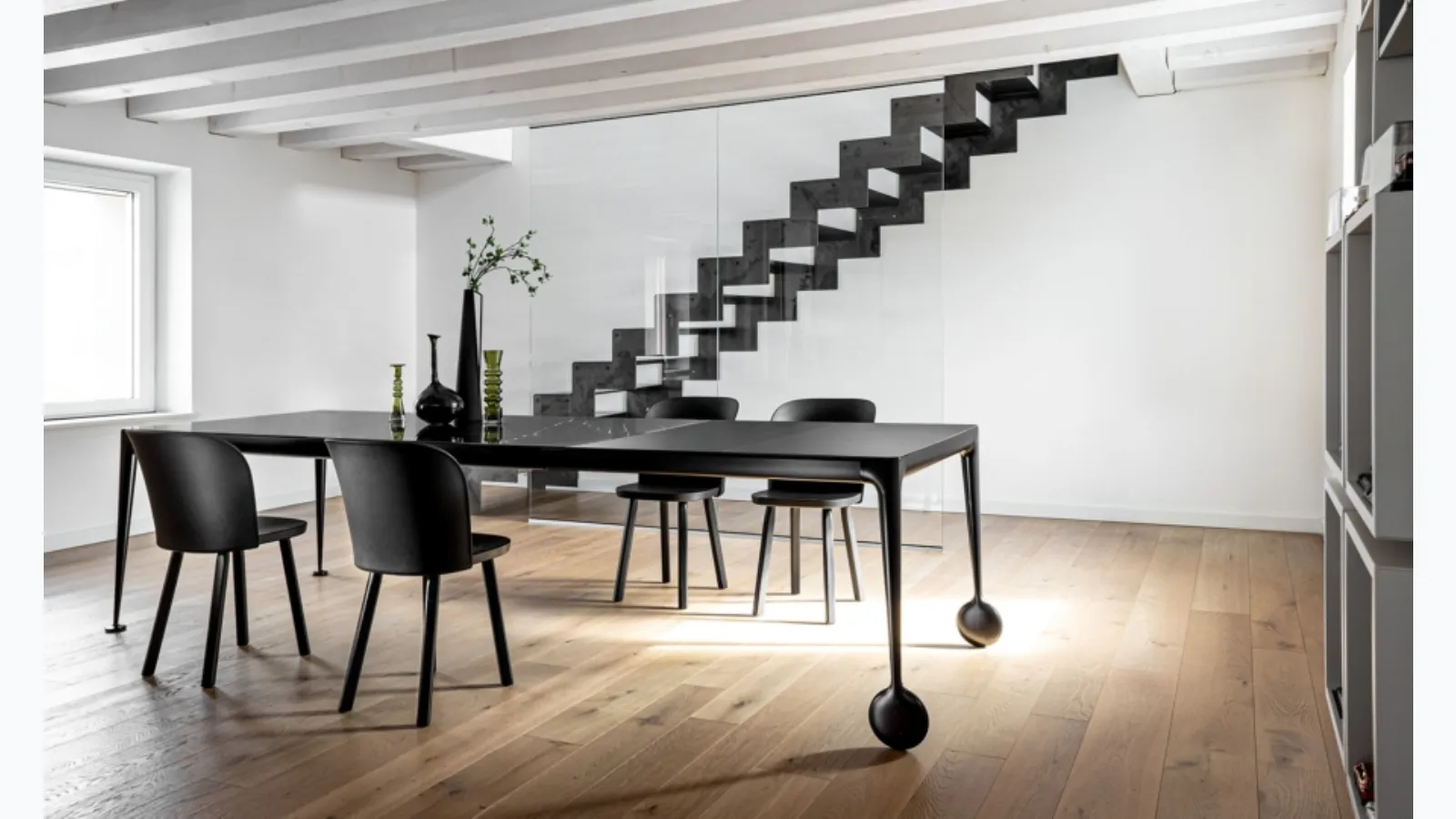 Chair with seat and legs in solid ash wood, backrest in Magis Alpina polypropylene.