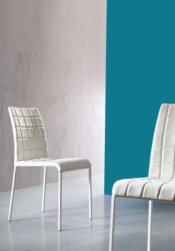 Anita chair upholstered in quilted eco-leather by Ingenia.