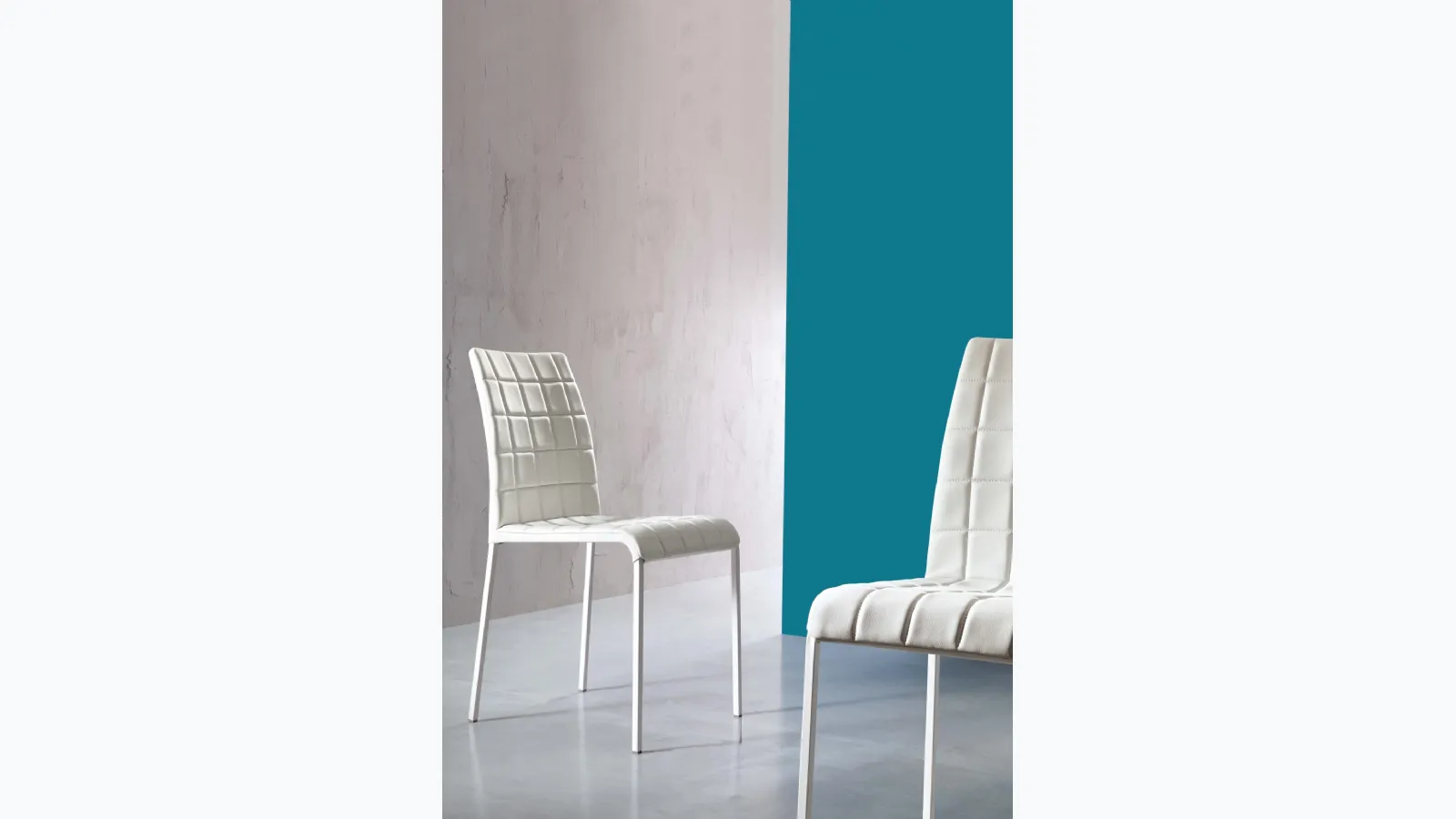 Anita chair upholstered in quilted eco-leather by Ingenia.