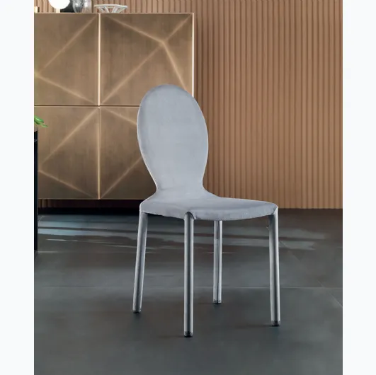 Designer chair upholstered in Anna fabric by Riflessi.