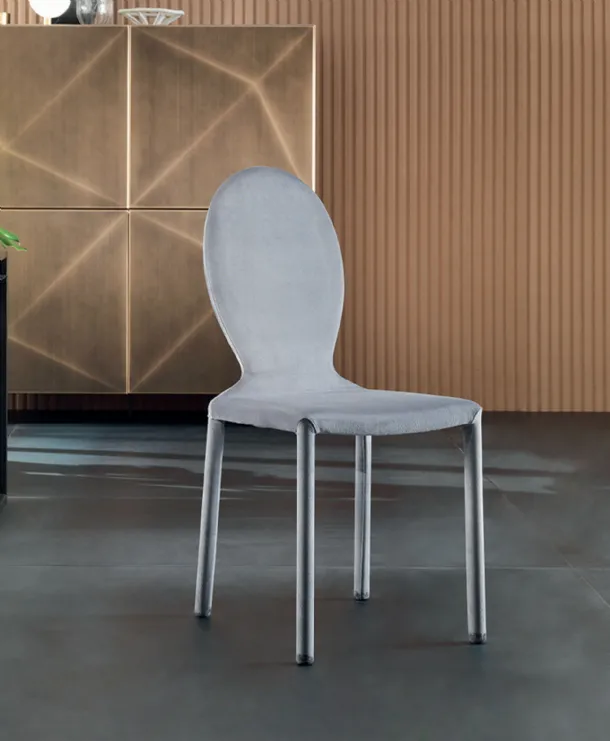 Designer chair upholstered in Anna fabric by Riflessi.