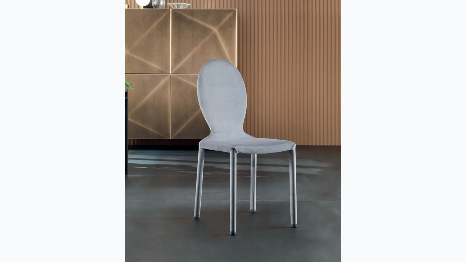 Designer chair upholstered in Anna fabric by Riflessi.